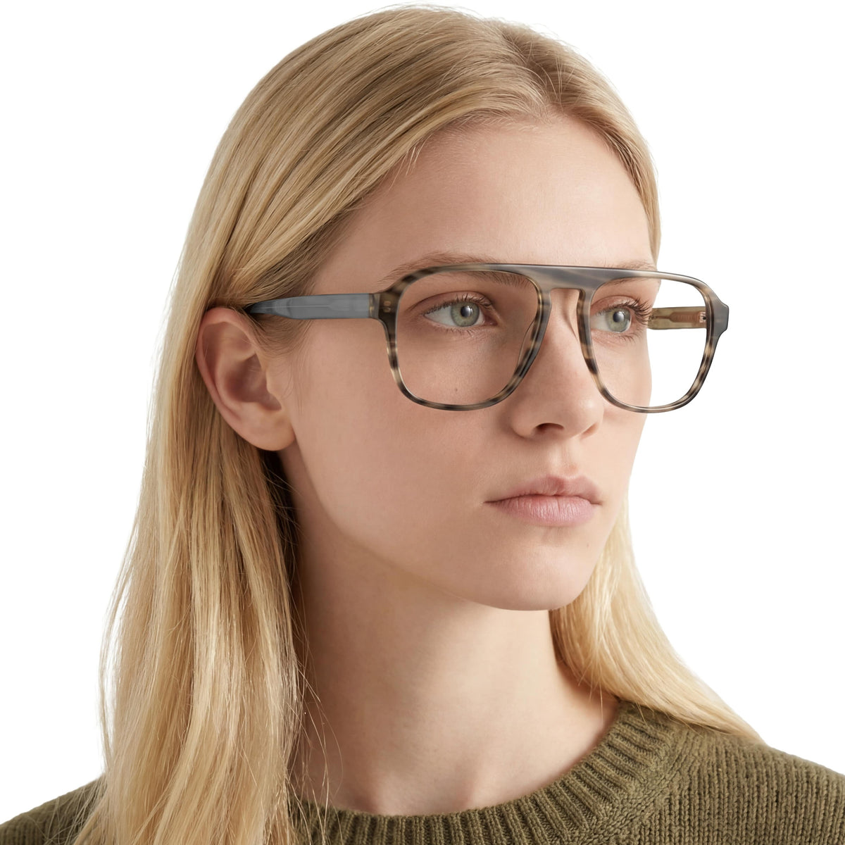 Woman wearing glasses with a neutral background
