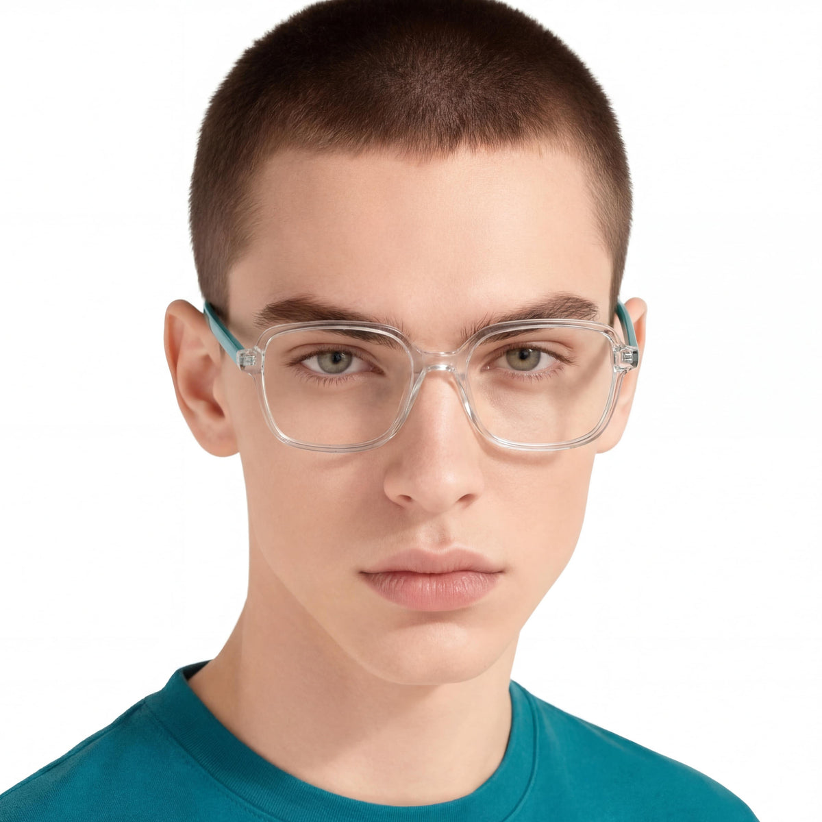 Person wearing clear glasses with teal frames on a white background