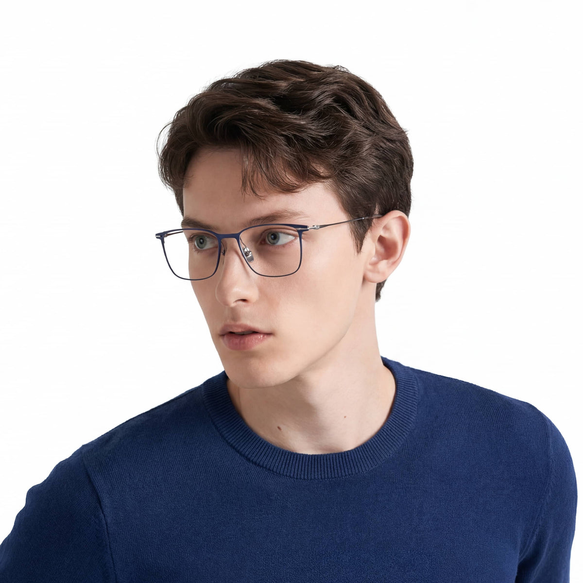 Man wearing glasses and a blue sweater on a white background