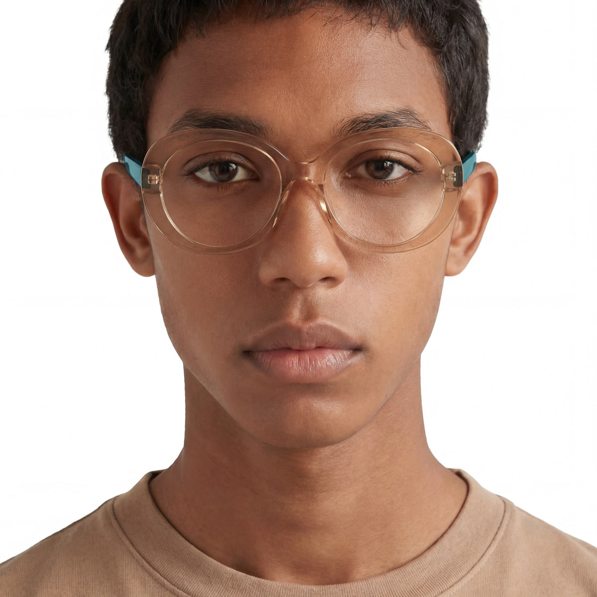 Person wearing clear glasses with blue accents on a white background