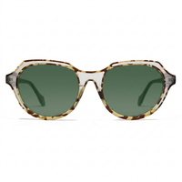 Oversized sunglasses with a translucent tortoiseshell frame and green-tinted lenses, shown against a plain white background.