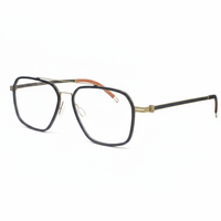 Black and gold eyeglasses on a white background