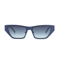 Matte navy blue cat-eye sunglasses with gradient gray-blue lenses, shown from the front on a white background.