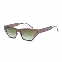 A pair of angular square sunglasses with a translucent brown frame and green gradient lenses, shown on a plain white background.