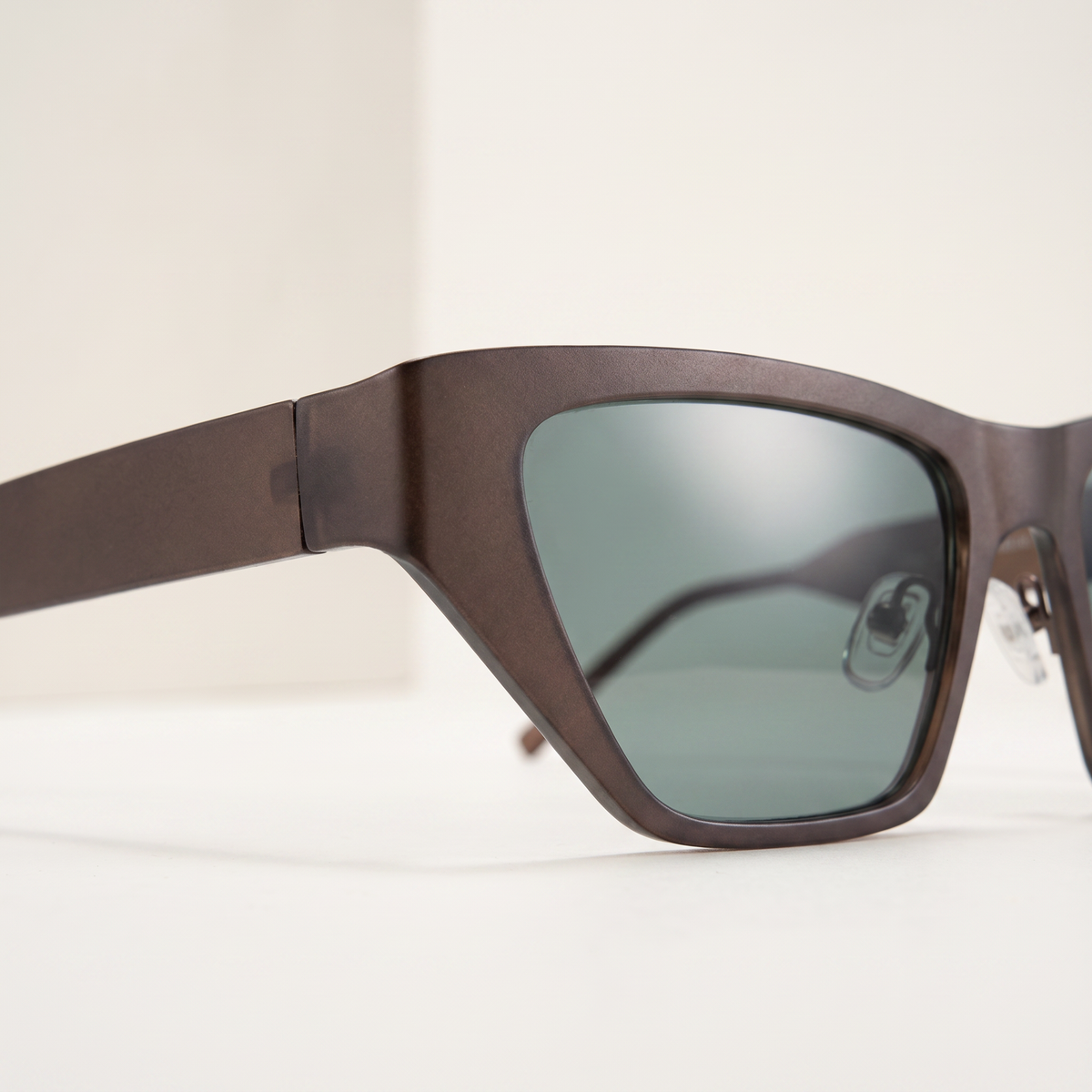 Featuring a classic cat-eye silhouette in brown tones, finished with...