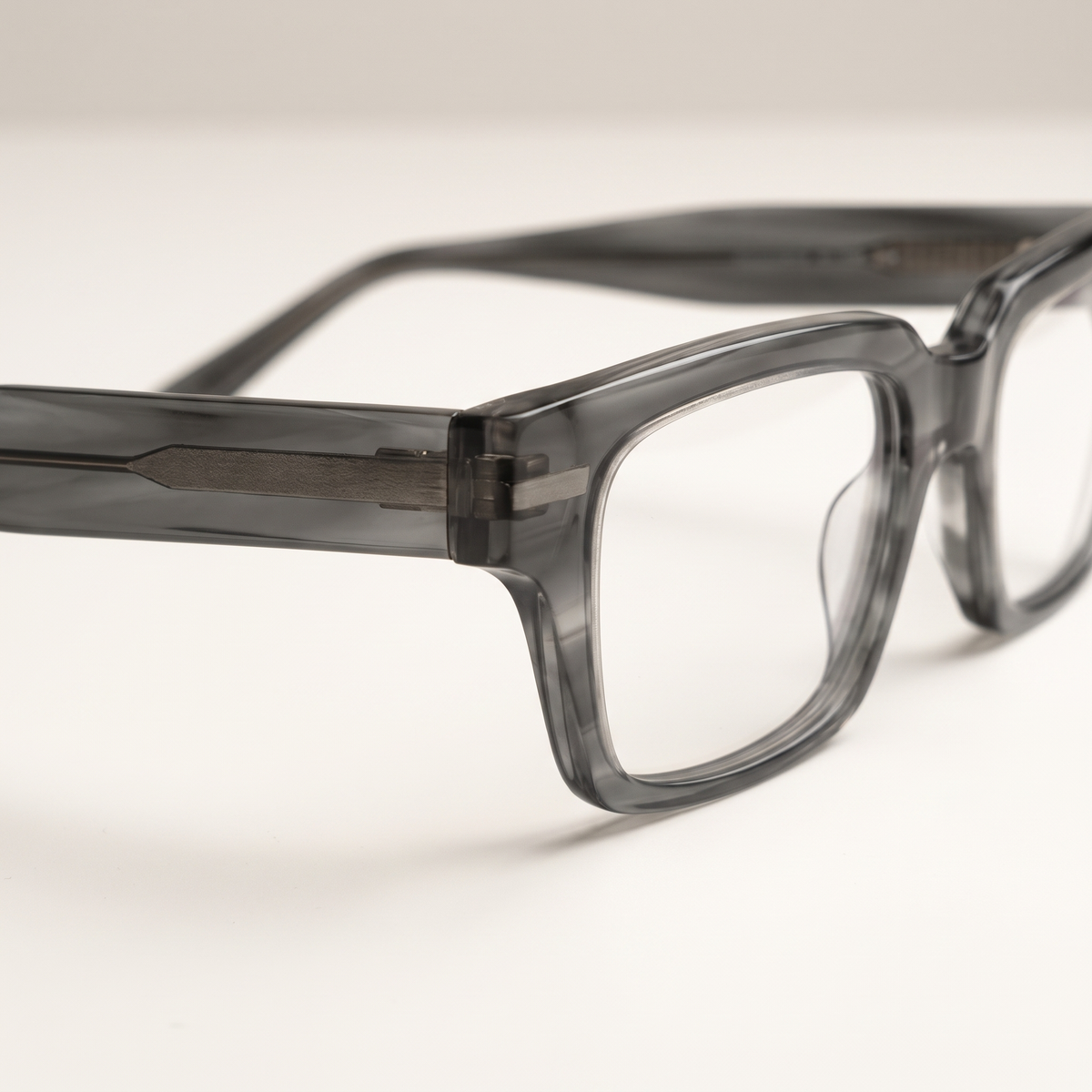 Featuring a classic rectangle silhouette in mineral grey acetate, finished...