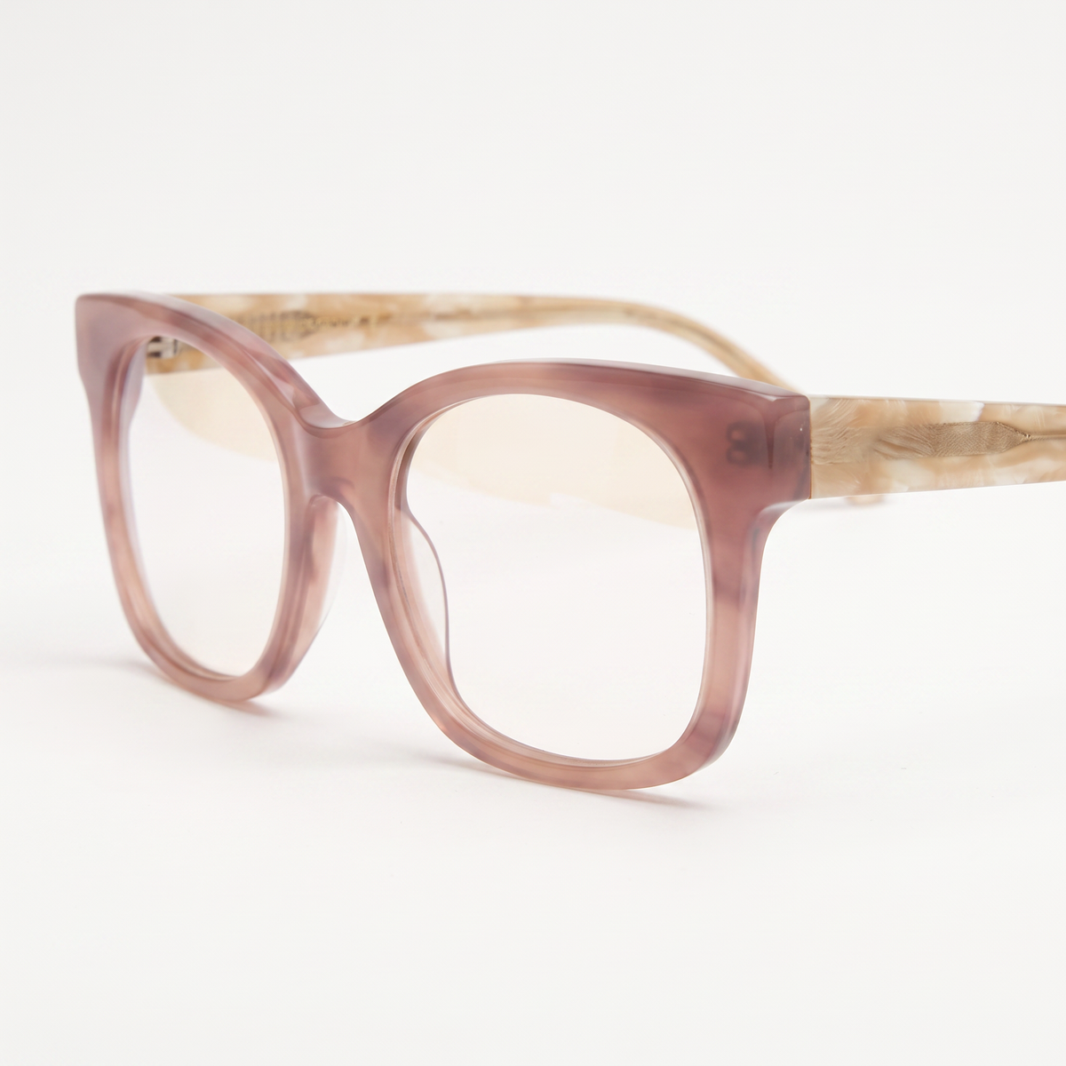 Featuring a classic cat-eye silhouette in terracotta acetate, finished with...