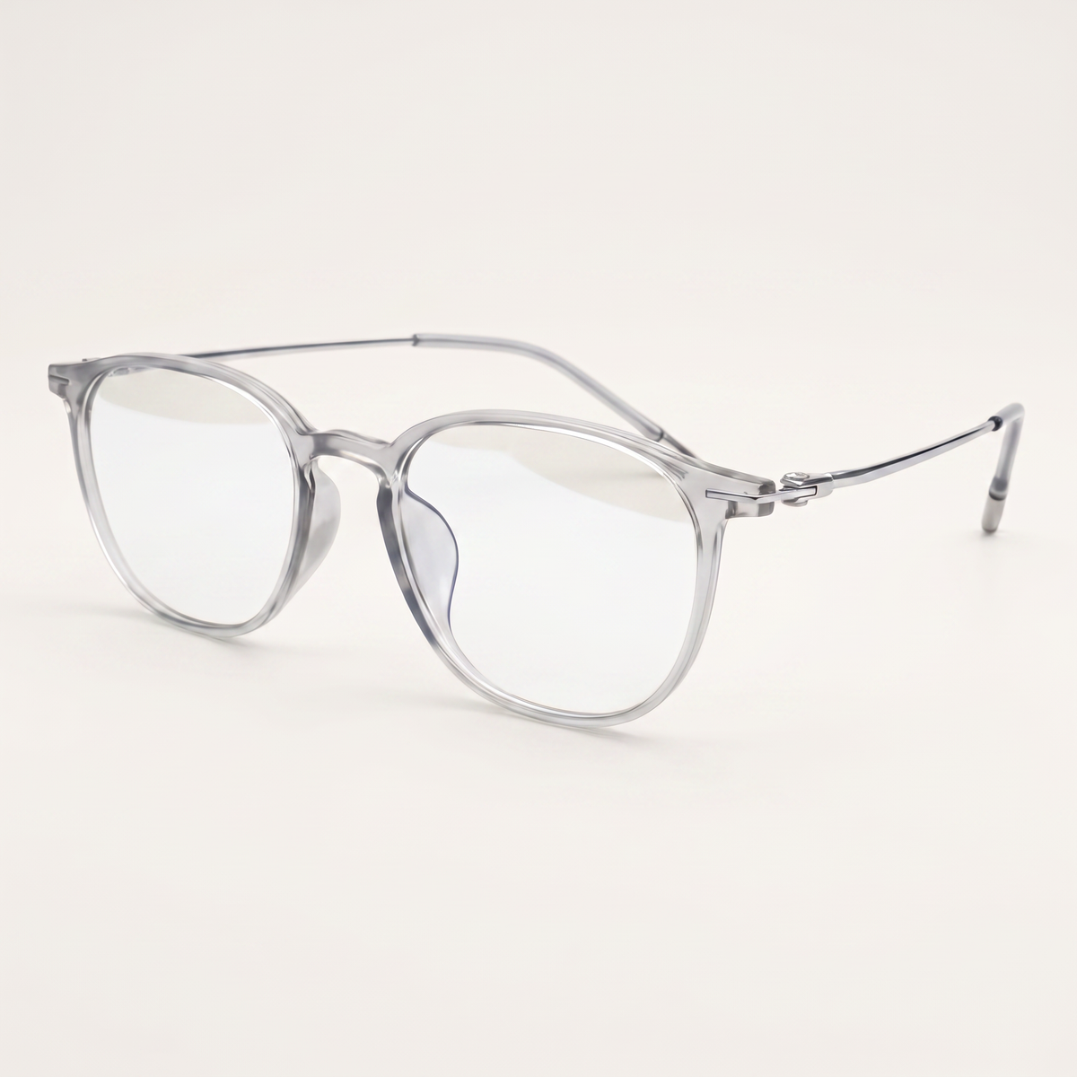 Featuring a classic round silhouette in transparent titanium, finished with...