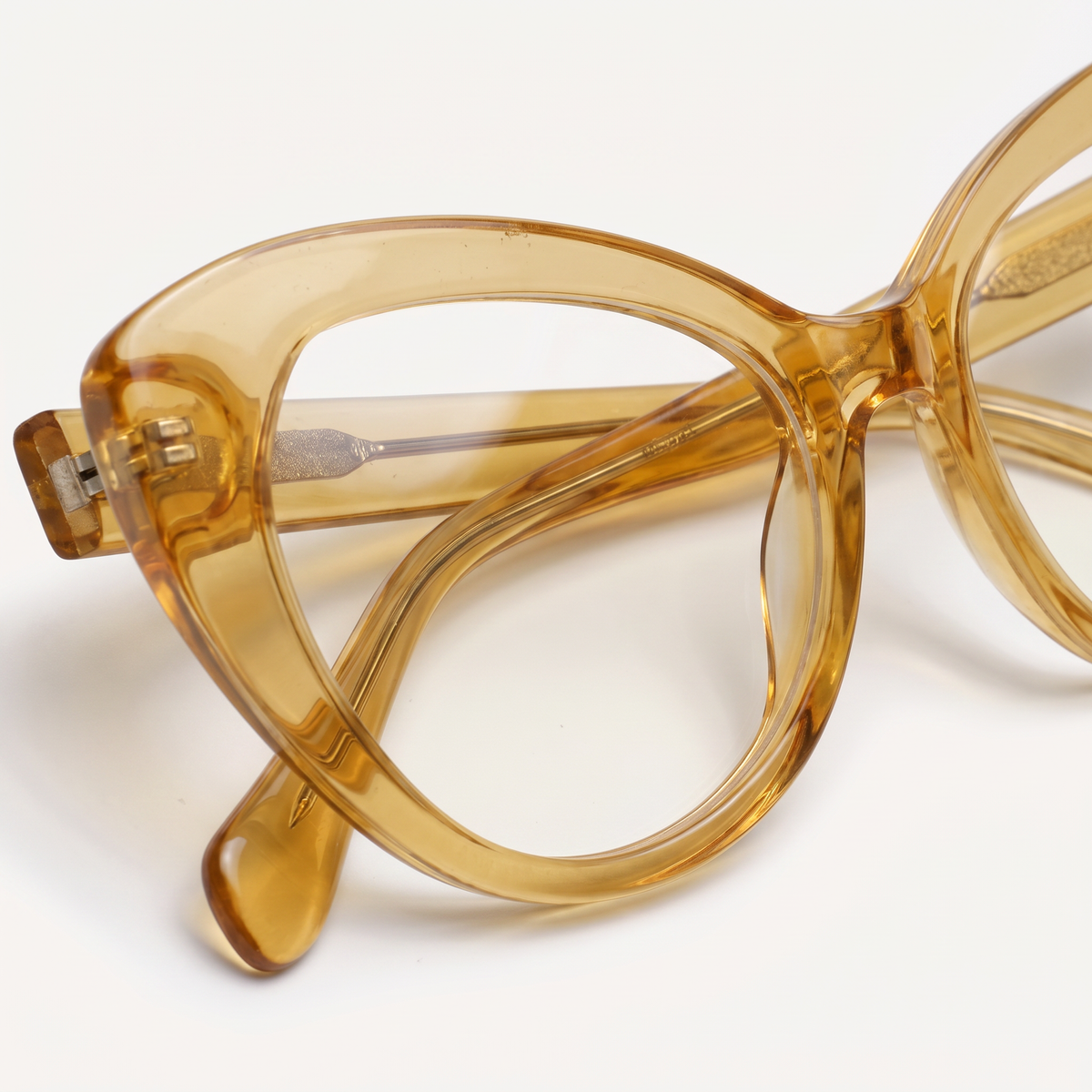 Featuring a classic cat-eye silhouette in bronze acetate, finished with...