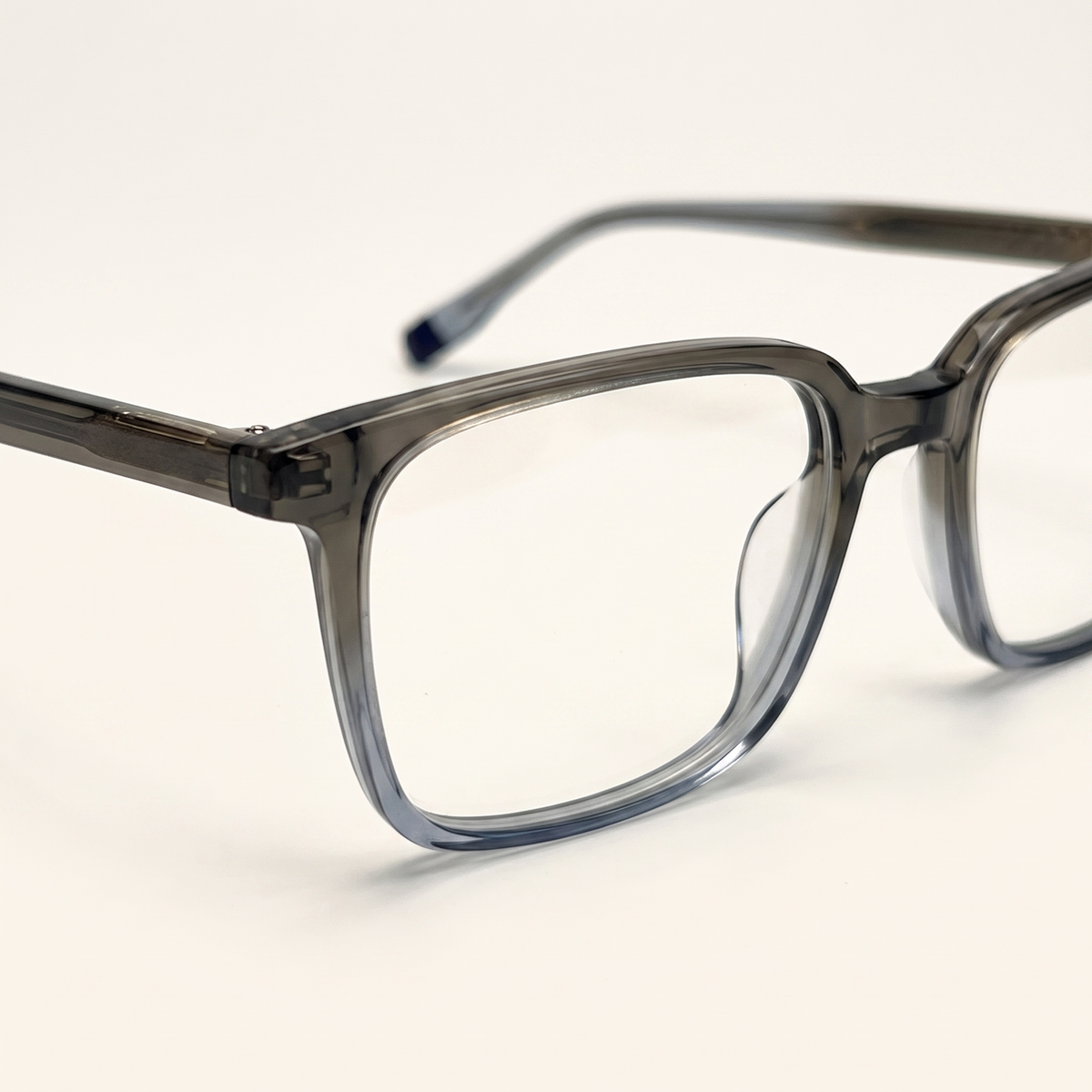 Featuring a classic square silhouette in mineral grey acetate, finished...