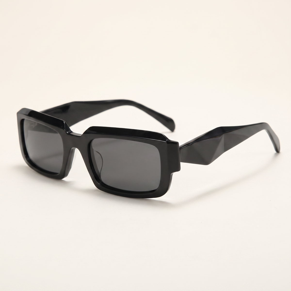 Featuring a classic rectangle silhouette in black tones, finished with...
