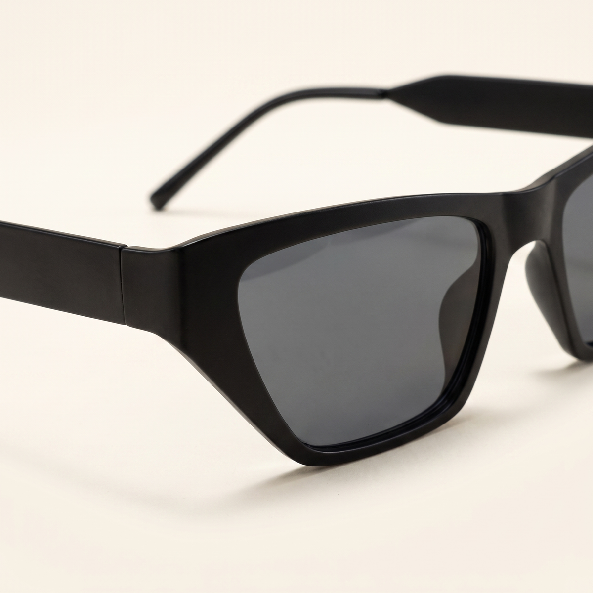 Featuring a classic cat-eye silhouette in black tones, finished with...