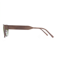A pair of sunglasses with a thick, matte brown metal frame and light green lenses, shown in a side profile view against a plain white background.