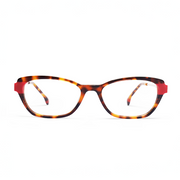 Tortoiseshell eyeglasses with red accents on a white background