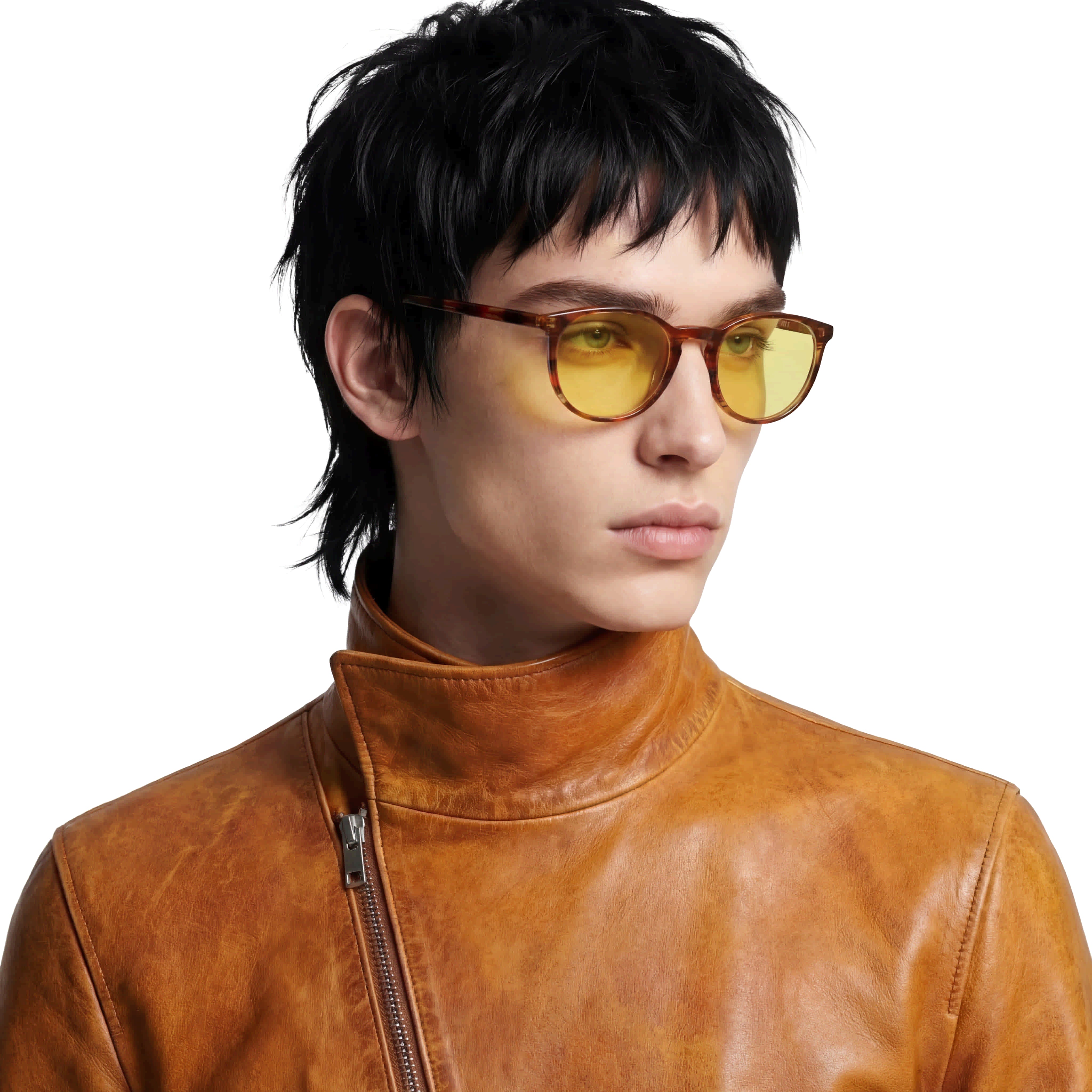 Person wearing a brown leather jacket and sunglasses with a neutral background