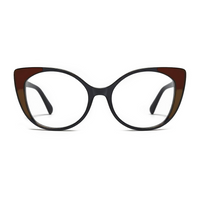 Cat-eye glasses with a black and brown frame on a white background