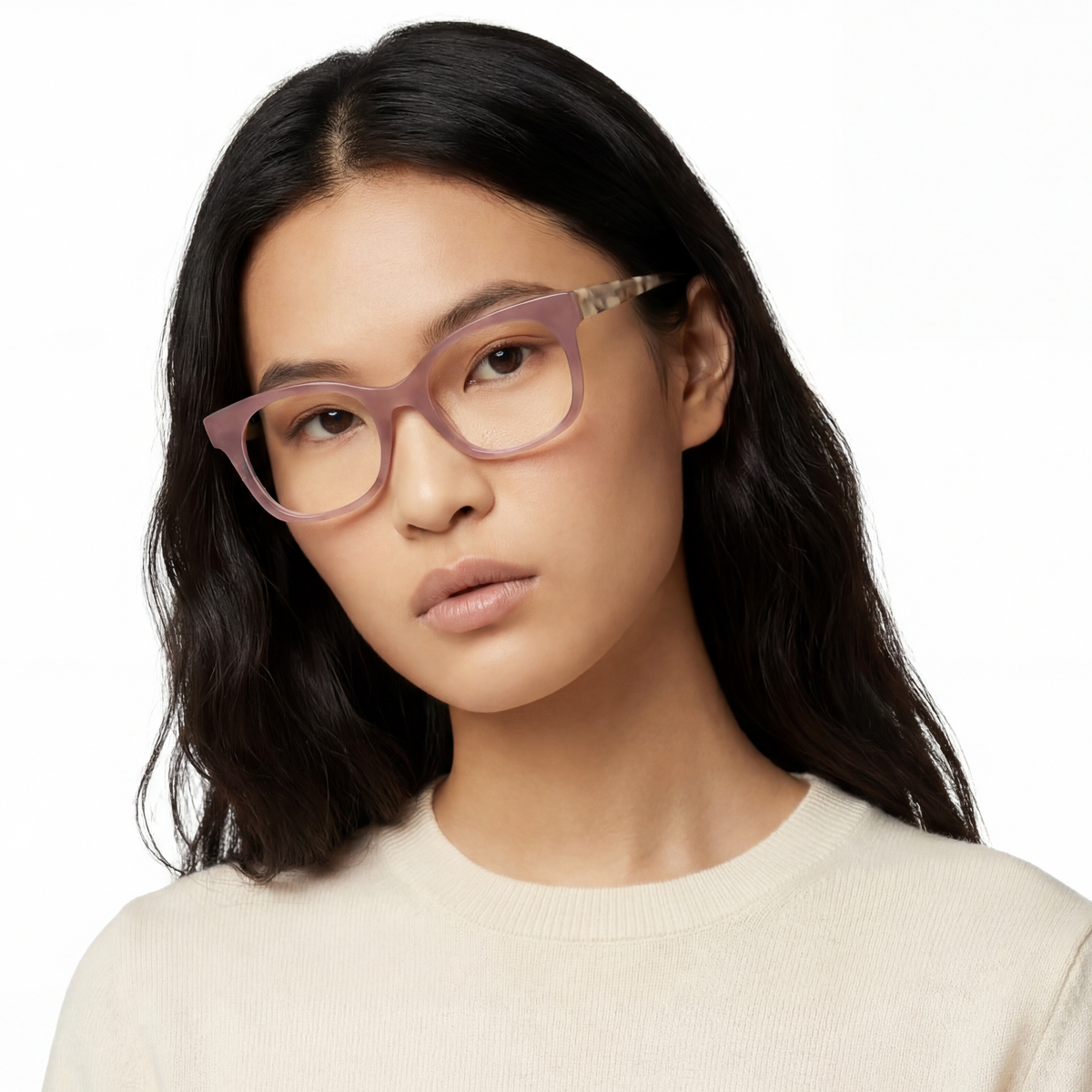 Woman wearing pink glasses against a white background