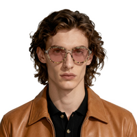 Man wearing a brown leather jacket and sunglasses on a white background