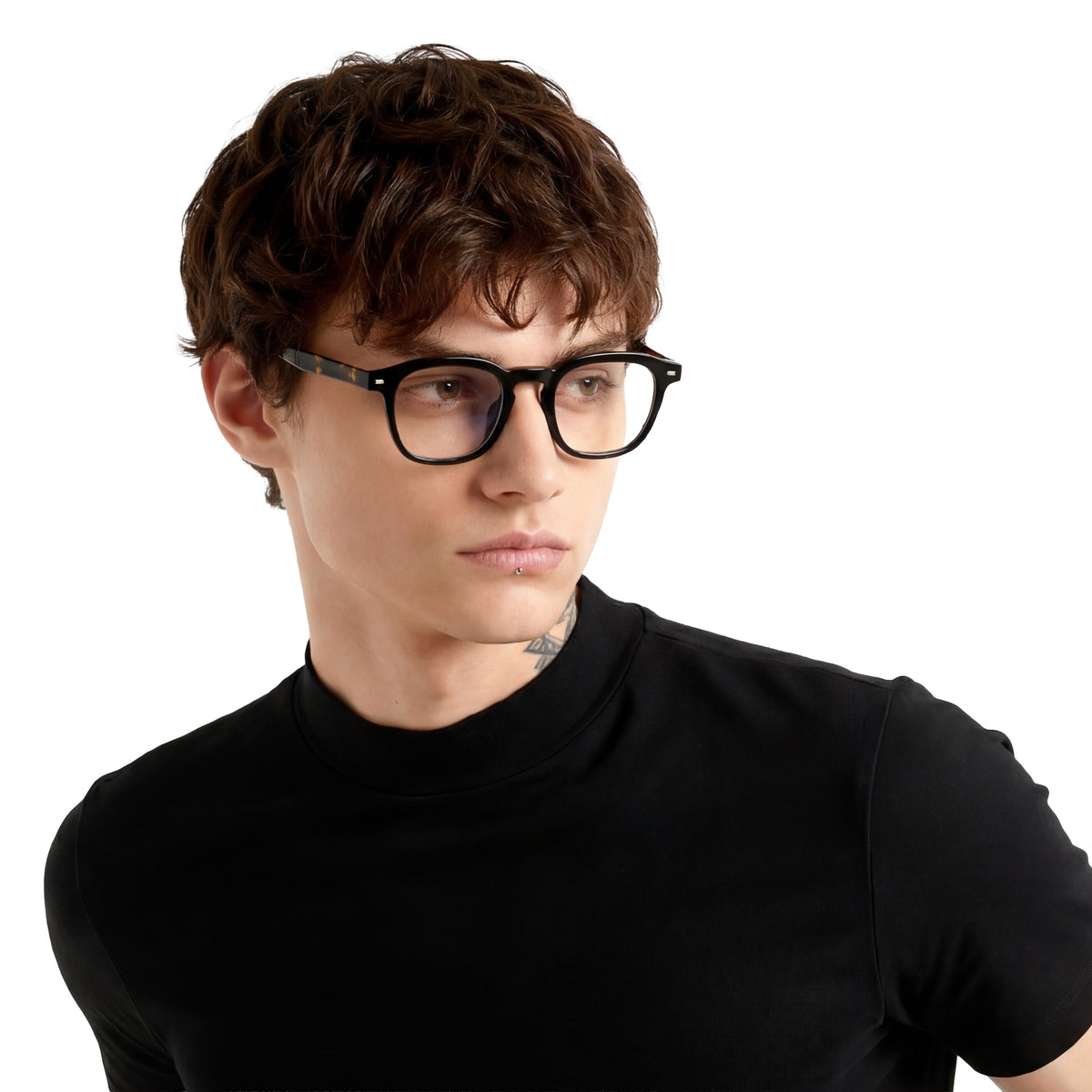 Person wearing black glasses and a black turtleneck on a white background