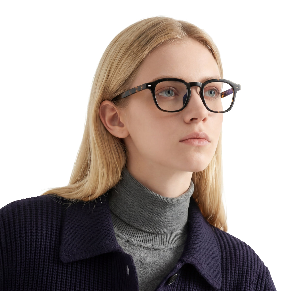 Person wearing glasses and a dark coat on a white background