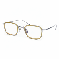 Gold and silver eyeglasses on a white background