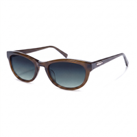 A pair of classic cat-eye sunglasses with a translucent brown acetate frame and dark gray gradient lenses, shown on a clean white background.