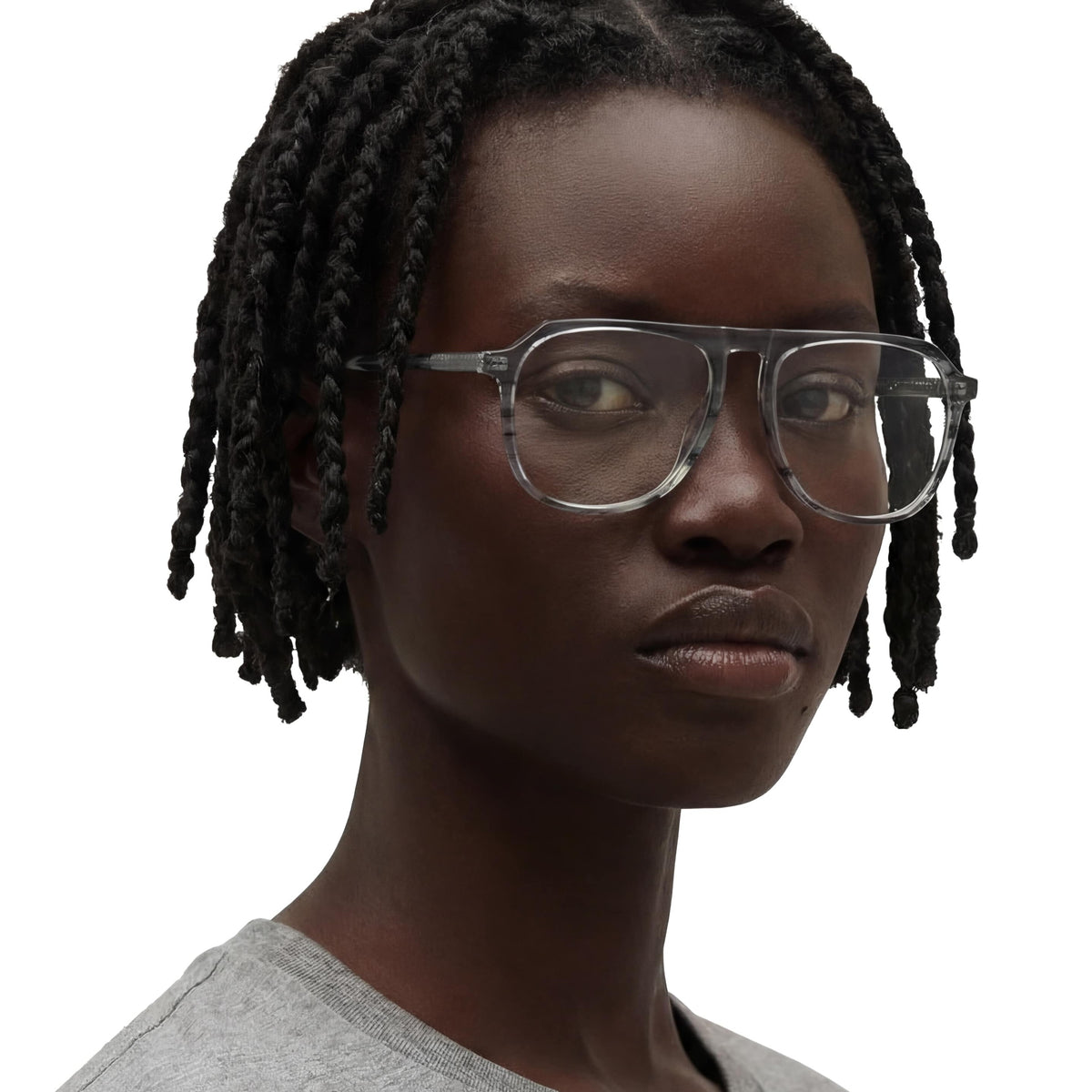 Person wearing glasses with a neutral background