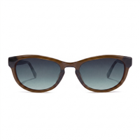 Oversized sunglasses with a translucent brown acetate frame and dark gray gradient lenses, shown against a plain white background.