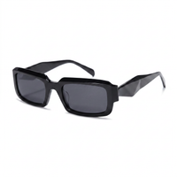 Black sunglasses with a brand logo on a white background