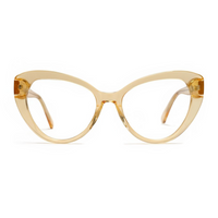 Cat-eye glasses with a beige frame on a white background