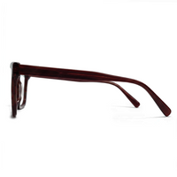 Black sunglasses with gold accents on a white background