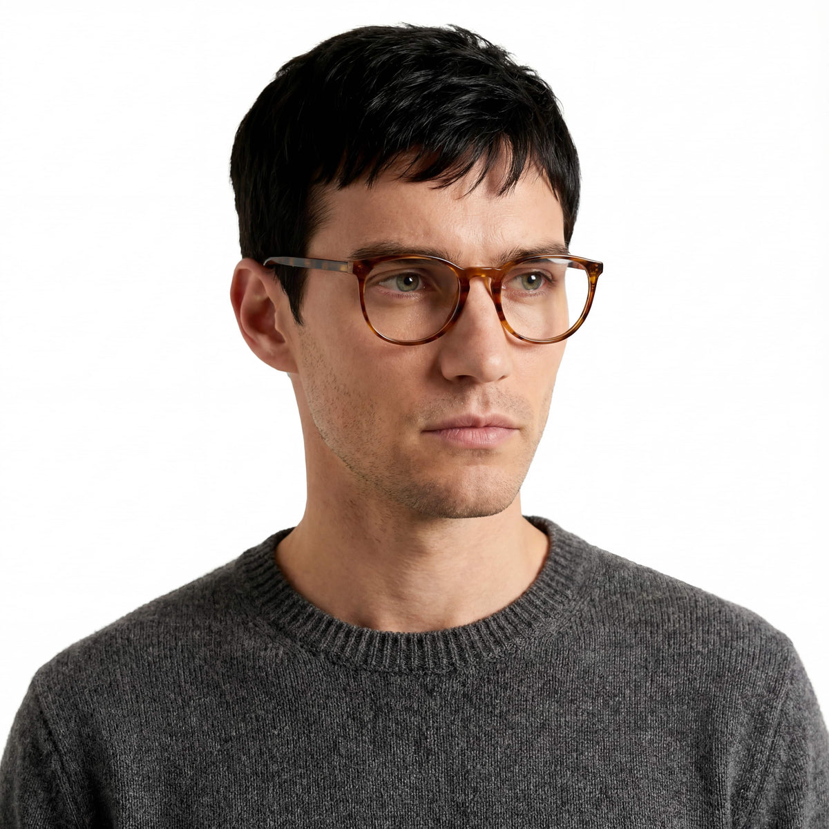 Man wearing glasses and a gray sweater on a white background