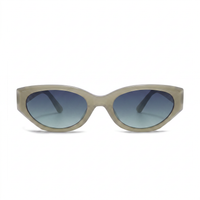 Oversized cat-eye sunglasses with a translucent light beige frame and blue gradient lenses, shown against a plain white background.