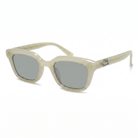Cream acetate sunglasses with silver mirrored lenses and a small silver logo accent on the temple arm, shown on a white background.