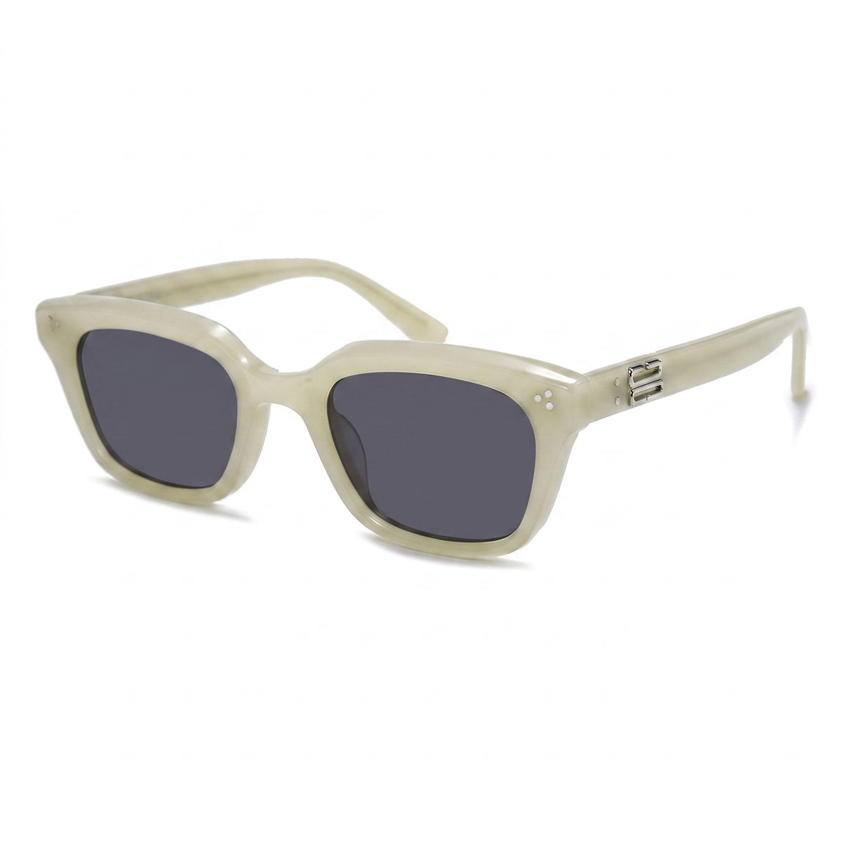 A pair of cat-eye sunglasses with a translucent cream-colored acetate frame and dark gray lenses, shown on a clean white background.
