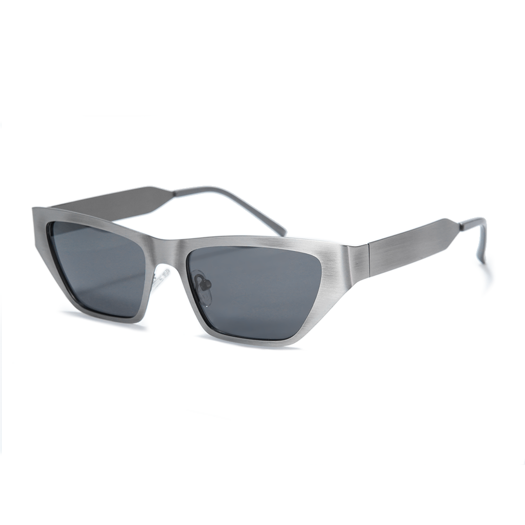 A pair of angular cat-eye sunglasses with a brushed silver metal frame and dark gray lenses, shown on a clean white background.