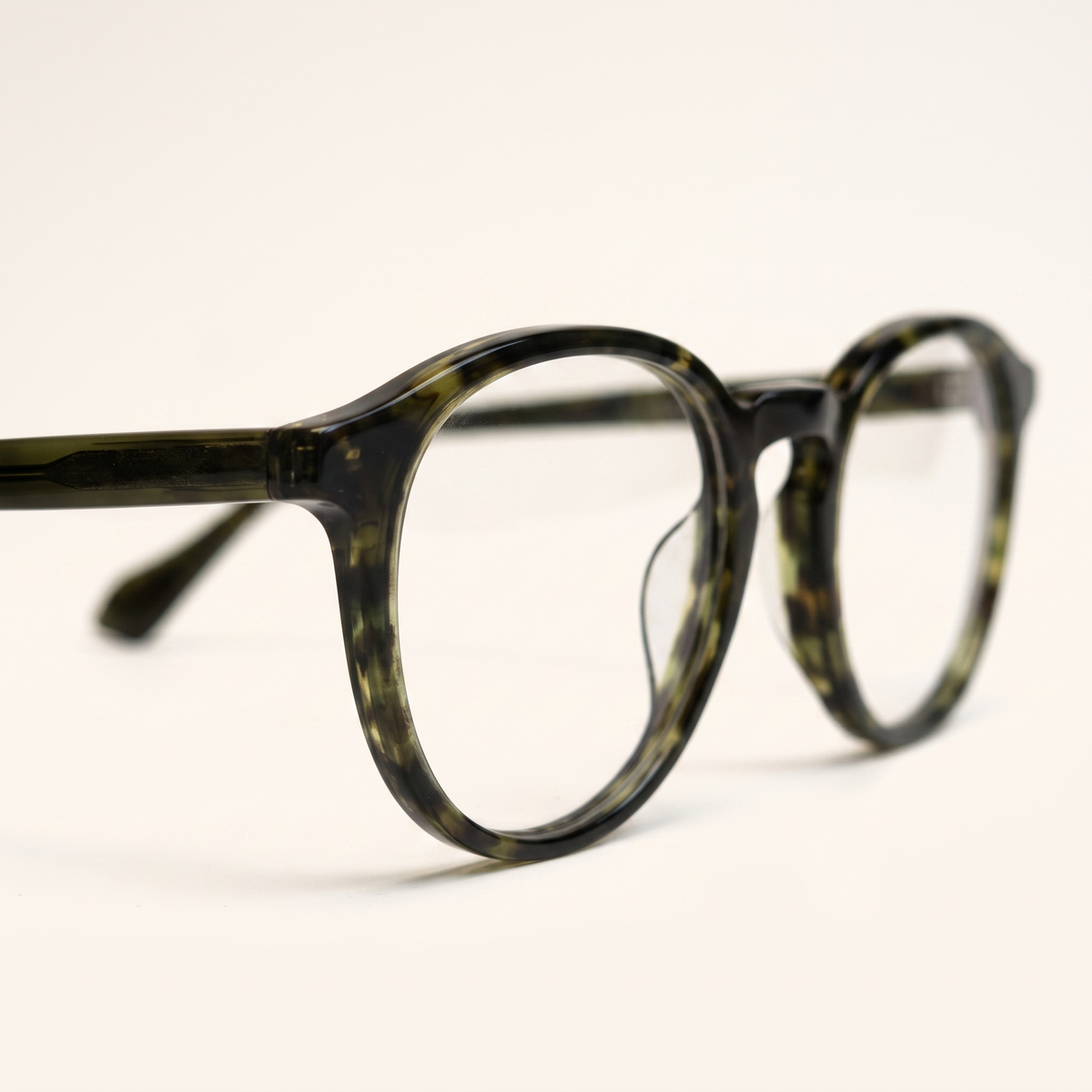 Featuring a classic round silhouette in black acetate, finished with...