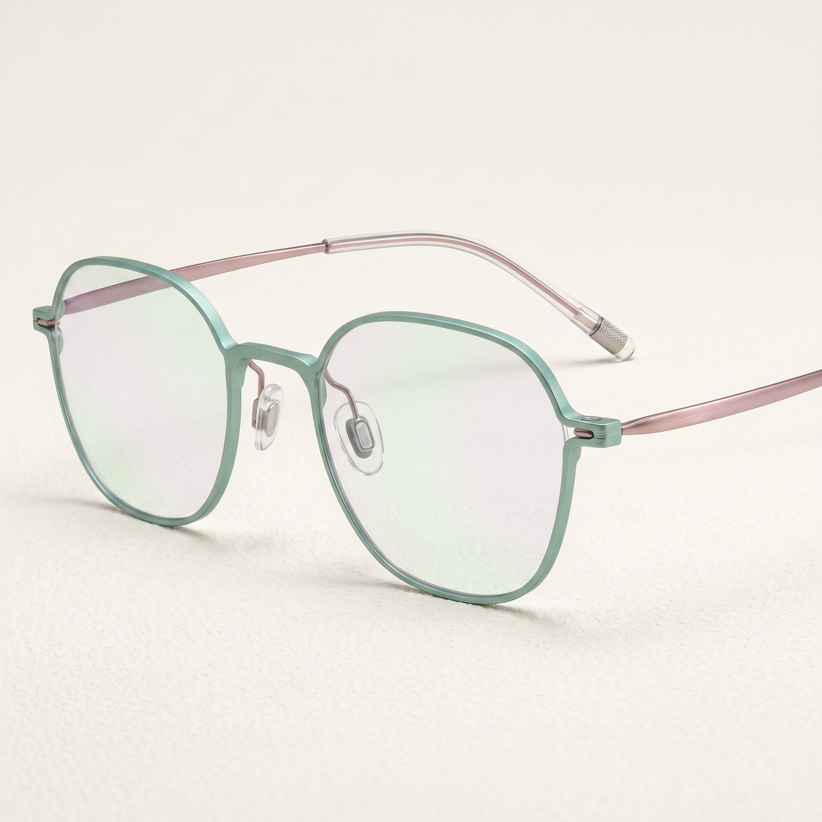 Featuring a classic round silhouette in matcha_green titanium, finished with...