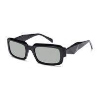 Sunglasses with tortoiseshell frame and gold accents on a white background
