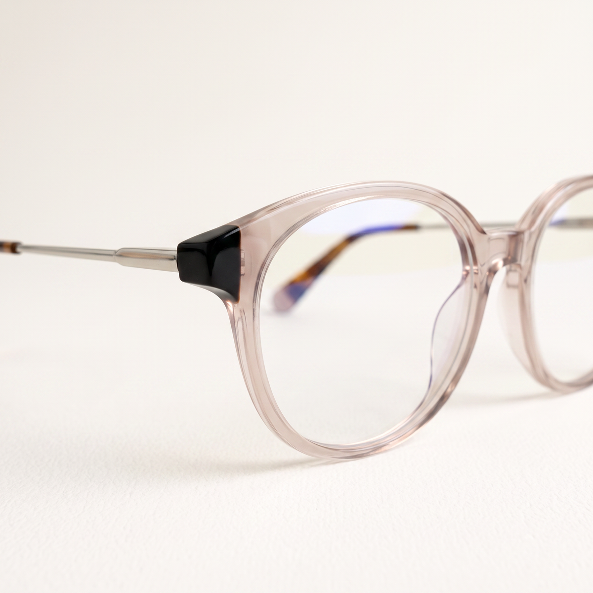 Featuring a classic round silhouette in brown acetate, finished with...