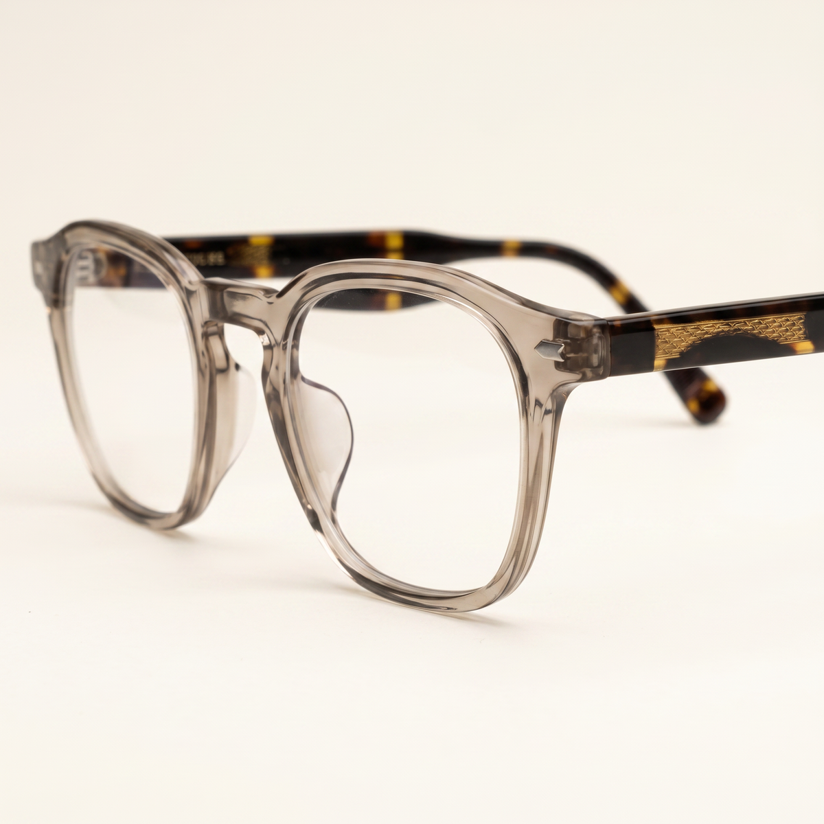 Featuring a classic square silhouette in solid brown acetate, finished...