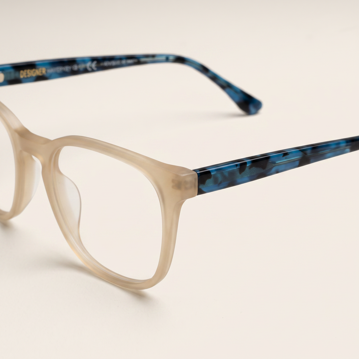 Featuring a classic round silhouette in beige acetate, finished with...