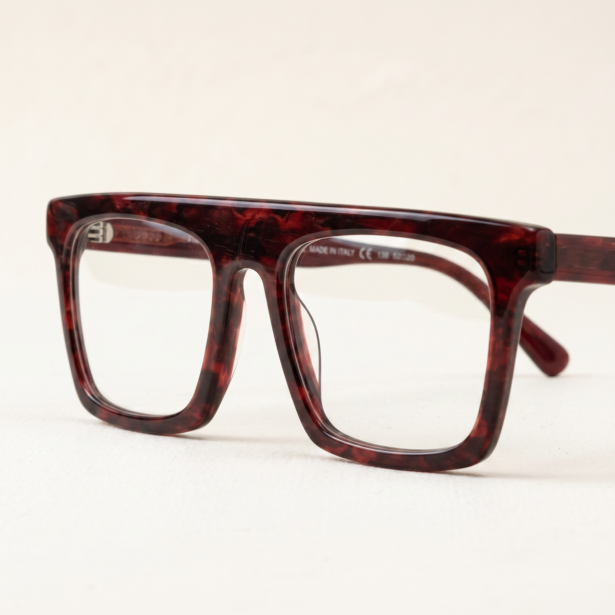 Featuring a classic rectangle silhouette in red-tortoiseshell acetate, finished with...