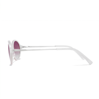 Oval sunglasses with a translucent white frame and pink-tinted lenses, shown in a side profile view against a solid white background.