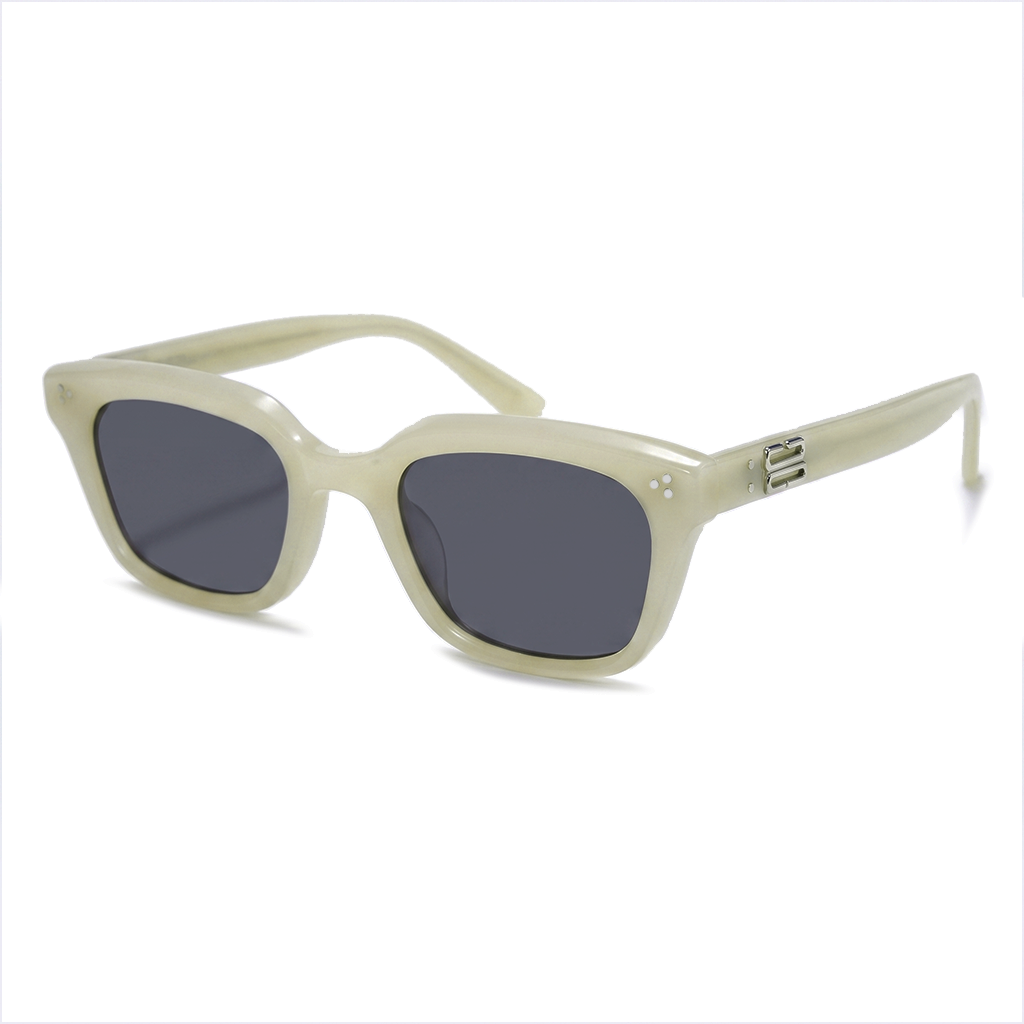 A pair of square sunglasses with a thick, glossy cream-colored frame and dark gray lenses, shown from a three-quarters angle on a white background.