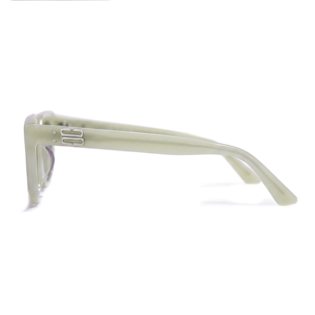 A close-up side profile of a pair of sunglasses with a thick, matte off-white frame on a clean white background.
