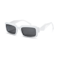 Sunglasses with dark lenses and blue frame on a white background