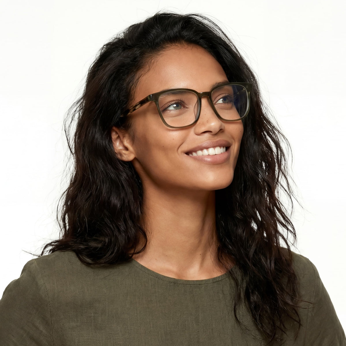 Woman wearing glasses and a green shirt on a white background
