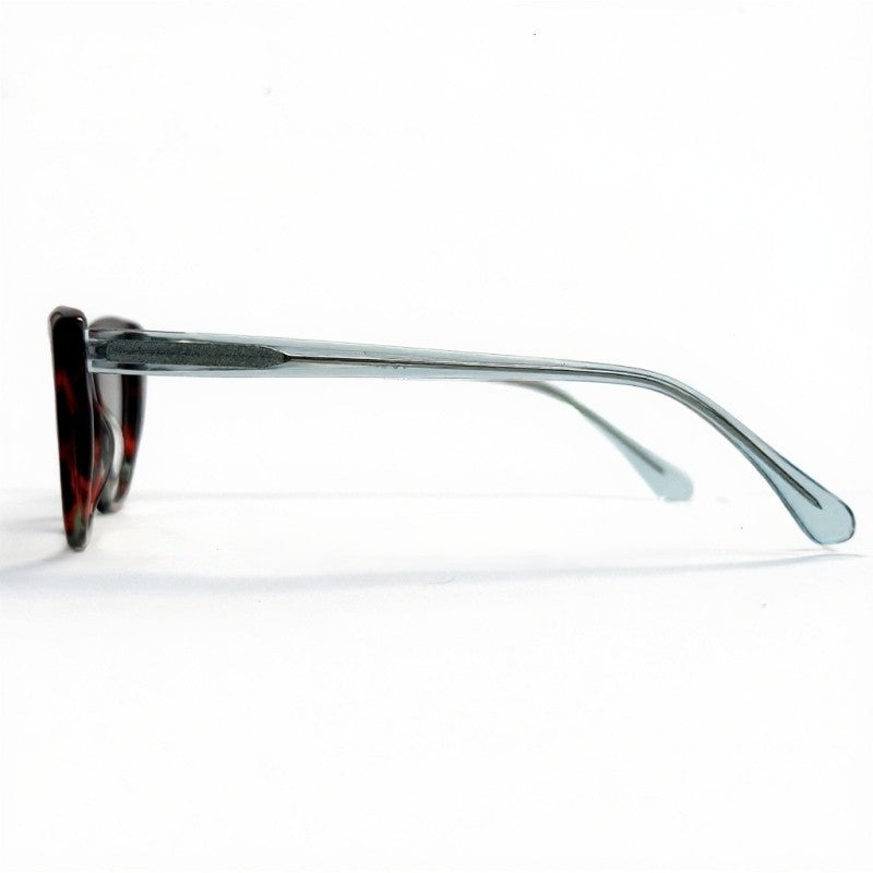 Sunglasses with a black frame and red accents on a white background