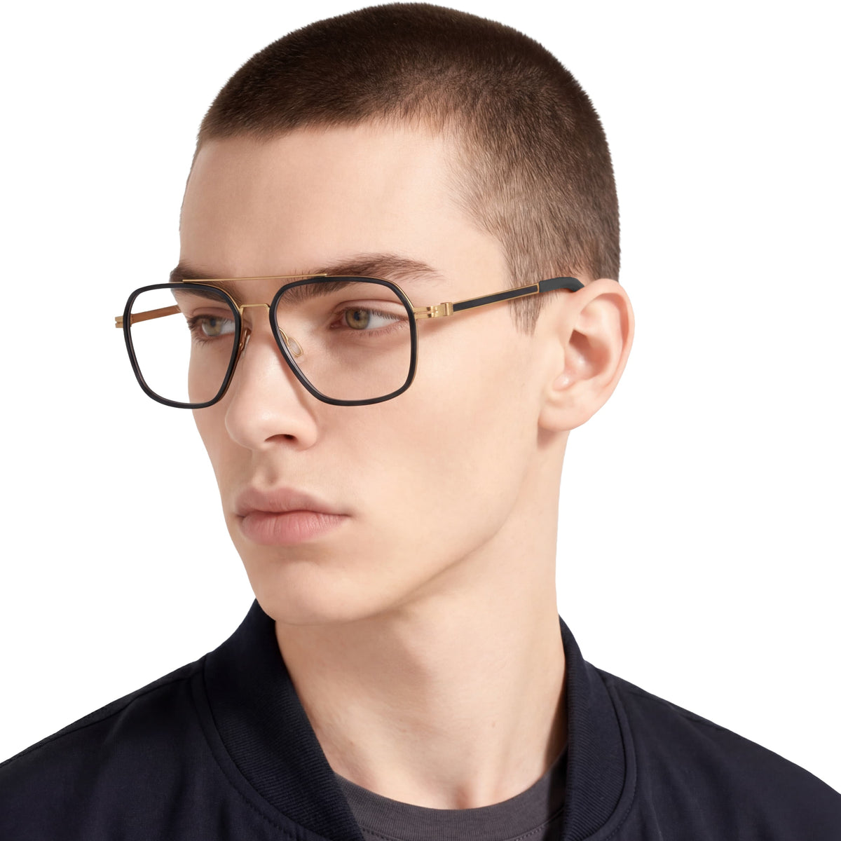 Person wearing a pair of glasses with a black frame on a white background